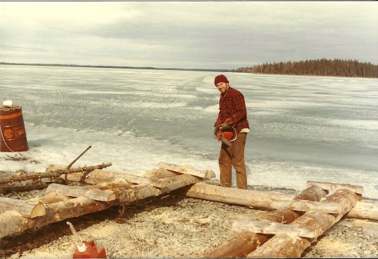 Building a dock! Skilak is frozen and you can see our "ice road" behind Sam as it heads toward Frying Pan Island!